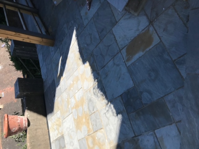 Acid staining on sandstone paving